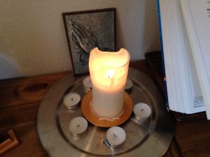 lit candle with tea lights